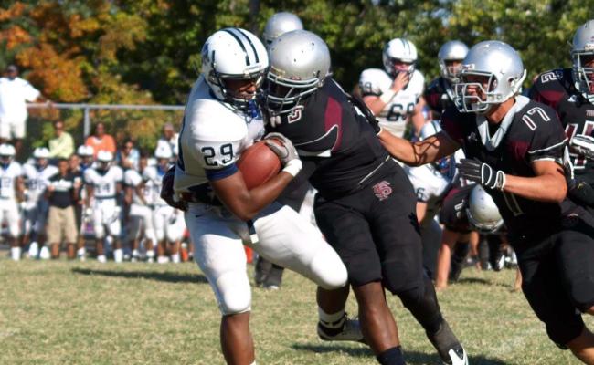 Hounds Defense Manhandles Scotties in Rain Soaked Opener